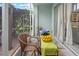 Relaxing screened patio with dining table, offering an inviting outdoor living space at 6027 Strada Isle Way, Orlando, FL 32835