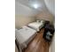 Cozy bedroom featuring two beds, hardwood floors, and neutral tones for a calming space at 6328 Raleigh St # 814, Orlando, FL 32835