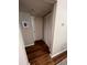 Hallway featuring wood flooring and closet storage at 6328 Raleigh St # 814, Orlando, FL 32835