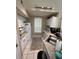 Functional kitchen with white appliances and tiled flooring at 6328 Raleigh St # 814, Orlando, FL 32835