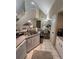 Modern kitchen leading to dining area with stainless steel appliances and granite counters at 6328 Raleigh St # 814, Orlando, FL 32835