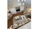 Bird's eye view of the living room with neutral colors, cozy seating, and hardwood floors at 6328 Raleigh St # 814, Orlando, FL 32835