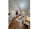 Bright living room featuring high ceilings, modern lighting, and stylish, neutral-toned furniture at 6328 Raleigh St # 814, Orlando, FL 32835