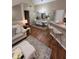 Inviting living room with modern decor, wood floors, and ample natural light at 6328 Raleigh St # 814, Orlando, FL 32835