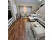 Open-concept living room with hardwood floors, plush seating, and large windows for natural light at 6328 Raleigh St # 814, Orlando, FL 32835