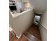 Wooden staircase leading to a bright living area at 6328 Raleigh St # 814, Orlando, FL 32835