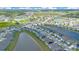 Aerial view of a community with homes, lakes, and natural green spaces at 633 Greymount St, Davenport, FL 33837