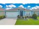 Charming single-Gathering home with well-manicured landscaping and a two-car garage at 633 Greymount St, Davenport, FL 33837