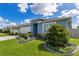 This beautiful home showcases lush landscaping, a well-kept lawn, and a freshly painted facade at 633 Greymount St, Davenport, FL 33837