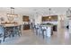 A well-designed kitchen with dark cabinets, a center island, and modern stainless-steel appliances at 633 Greymount St, Davenport, FL 33837