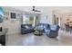 Cozy living room featuring comfortable seating, neutral colors, and a window with natural light at 633 Greymount St, Davenport, FL 33837