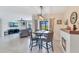 Bright open concept living space featuring a dining area, tile floors, and views into living room at 633 Greymount St, Davenport, FL 33837