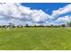 Community playground featuring open green space for games and activities at 633 Greymount St, Davenport, FL 33837