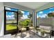 Inviting sunroom with comfortable seating and serene outdoor views at 633 Greymount St, Davenport, FL 33837