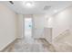 Upstairs hallway with neutral walls and carpet leading to rooms flooded with natural light at 6331 Breeze Filled Ln, Winter Garden, FL 34787