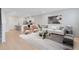 Cozy living room with an open layout that seamlessly blends with a modern kitchen design at 6331 Breeze Filled Ln, Winter Garden, FL 34787