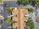 Aerial view of the building showing ample parking, landscaping and roof details at 645 Stafford Ter # 163, Altamonte Springs, FL 32714