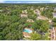 Aerial view of community featuring lush landscaping, mature trees and community pool at 645 Stafford Ter # 163, Altamonte Springs, FL 32714