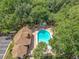 Aerial view of the community pool, hot tub, lounge area and trees at 645 Stafford Ter # 163, Altamonte Springs, FL 32714
