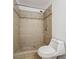 Updated bathroom featuring a tiled shower with decorative mosaic accents and modern fixtures at 645 Stafford Ter # 163, Altamonte Springs, FL 32714