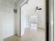 Open bedroom with tile flooring, closet and french doors to living area at 645 Stafford Ter # 163, Altamonte Springs, FL 32714