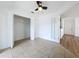 Open bedroom with tile flooring, ceiling fan and closet with double doors at 645 Stafford Ter # 163, Altamonte Springs, FL 32714