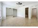 Bright bedroom with neutral tile flooring, ceiling fan and closet with mirrored doors at 645 Stafford Ter # 163, Altamonte Springs, FL 32714