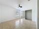 Light and airy bedroom with tile flooring, ceiling fan and closet with mirrored doors at 645 Stafford Ter # 163, Altamonte Springs, FL 32714