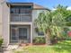 Exterior view of the home featuring a screened patio and an upstairs balcony at 645 Stafford Ter # 163, Altamonte Springs, FL 32714