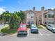 Townhome with dedicated parking, lush landscaping, and direct access to the home's entryway at 645 Stafford Ter # 163, Altamonte Springs, FL 32714