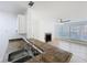 Open concept kitchen with wood flooring, breakfast bar and a view into the bright living room at 645 Stafford Ter # 163, Altamonte Springs, FL 32714