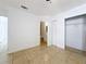 Bright main bedroom featuring a bathroom, and closet with sliding doors at 645 Stafford Ter # 163, Altamonte Springs, FL 32714