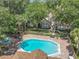 Beautiful aerial view of the community pool featuring inviting lounge furniture at 645 Stafford Ter # 163, Altamonte Springs, FL 32714