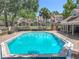 Inviting community pool with manicured landscaping and buildings in the background at 645 Stafford Ter # 163, Altamonte Springs, FL 32714