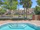 Gated community pool with steps and a clear view of the residential buildings at 645 Stafford Ter # 163, Altamonte Springs, FL 32714