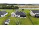 Aerial view of backyard and outdoor living space including patio with furniture and RV parking at 7191 Old Melbourne Hwy, St Cloud, FL 34771
