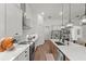 Modern kitchen featuring white cabinetry, stainless steel appliances, a large island, and open layout at 7191 Old Melbourne Hwy, St Cloud, FL 34771