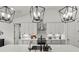 Modern kitchen with stainless steel appliances, a center island with sink, and stylish pendant lights at 7191 Old Melbourne Hwy, St Cloud, FL 34771