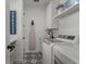 Laundry room features modern appliances, farmhouse decor and patterned floor tiles at 7191 Old Melbourne Hwy, St Cloud, FL 34771
