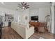 Open-concept living room featuring modern decor, a comfortable seating area, and stylish accents at 7191 Old Melbourne Hwy, St Cloud, FL 34771