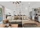 Bright living room featuring an open layout, modern decor, and a seamless flow to the kitchen at 7191 Old Melbourne Hwy, St Cloud, FL 34771