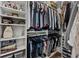 Organized walk-in closet with shelving and hanging space for clothes and accessories at 7191 Old Melbourne Hwy, St Cloud, FL 34771