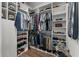 Spacious walk-in closet offering ample storage with built-in shelving and hanging racks at 7191 Old Melbourne Hwy, St Cloud, FL 34771