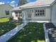 Inviting entrance with well-maintained landscaping and a charming walkway leading to the front door at 732 Palma Dr, Lady Lake, FL 32159