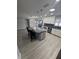 Open-concept kitchen boasts a granite island with seating and stainless steel appliances at 732 Palma Dr, Lady Lake, FL 32159