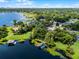 Beautiful aerial view showcasing a waterfront community with mature trees at 8625 Vista Point Cv, Orlando, FL 32836