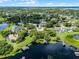 Aerial view of a lakeside community, showing the home's location and surroundings at 8625 Vista Point Cv, Orlando, FL 32836