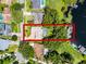 Overhead view of single-story home featuring a sparkling pool and waterfront access to the adjacent lake at 8625 Vista Point Cv, Orlando, FL 32836