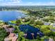 Expansive aerial view of a lakeside community, highlighting the waterfront homes at 8625 Vista Point Cv, Orlando, FL 32836