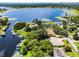 Large aerial view showing several homes, docks, and bodies of water at 8625 Vista Point Cv, Orlando, FL 32836